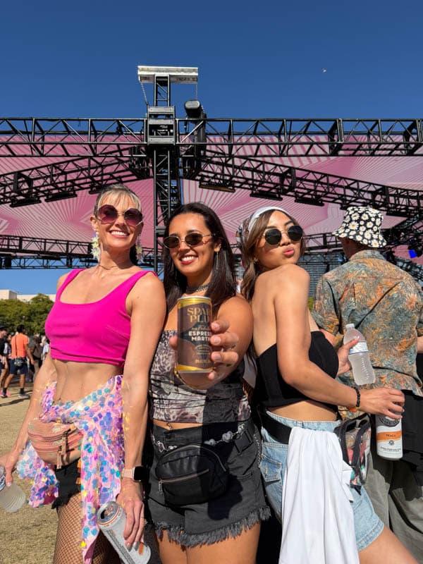 Festival-goers raising a Spark Plug espresso martini at Horizon Fest, San Diego